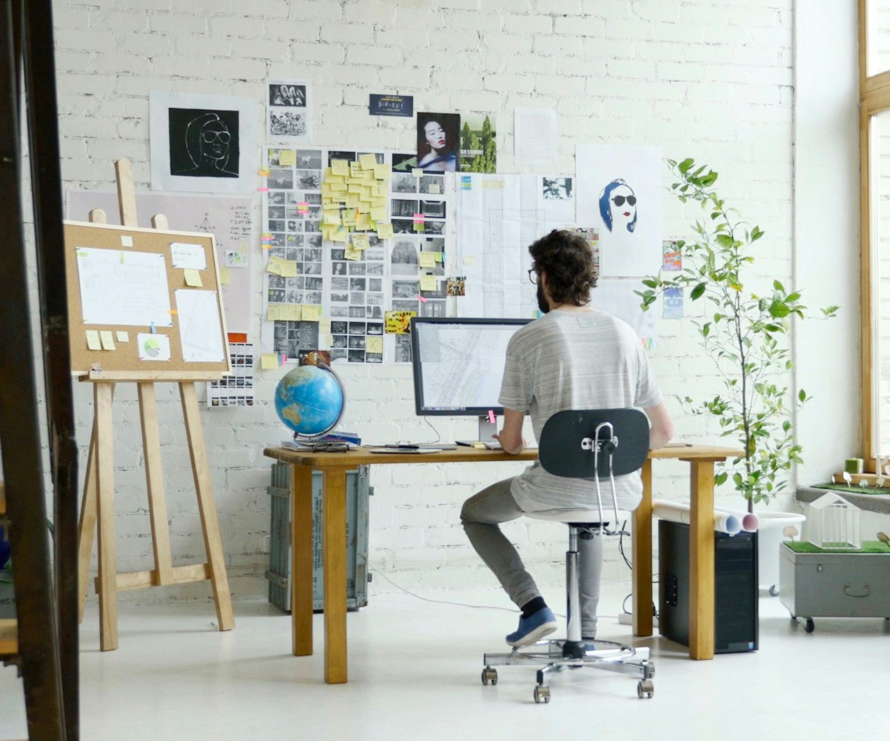You don't have to be a one man show. DIY e-commerce business owner seated at desk working on computer